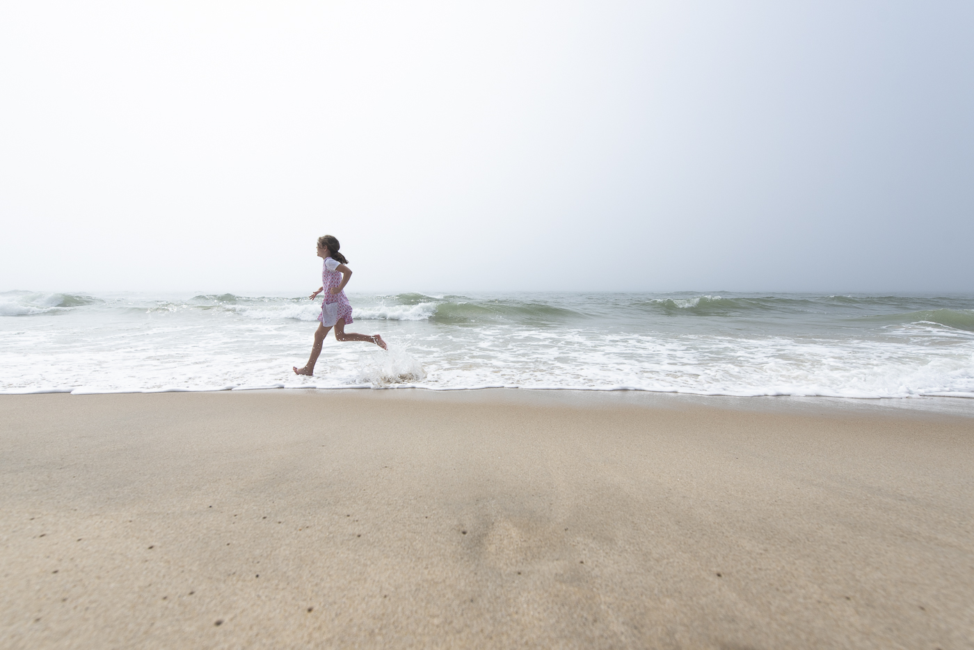 Chilmark, Massachusetts beach girl running fog